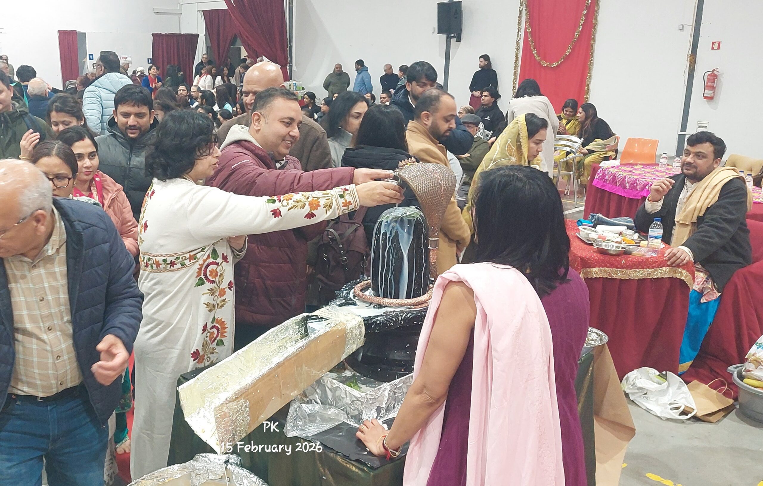 Devotees performing Abhishek at Shiv Mandir Portugal