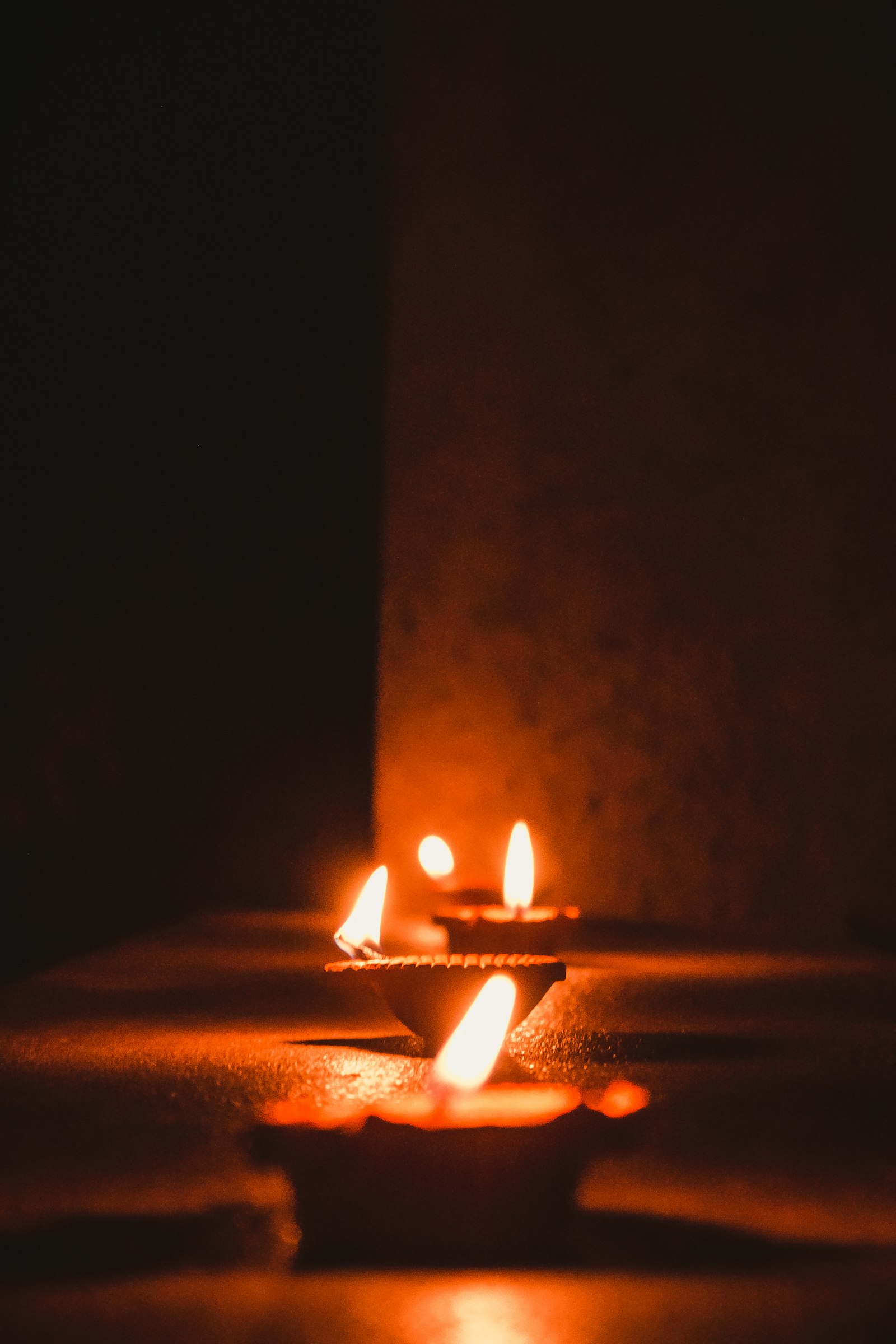 Traditional Hindu diya oil lamps glowing warmly